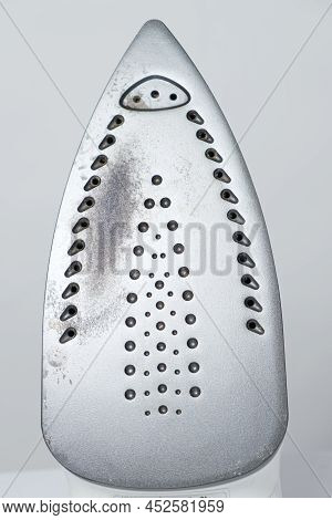 Damaged Sole Of The Iron, Brown Stains And Traces Of Burning With Smoke And Steam. Improper Behavior