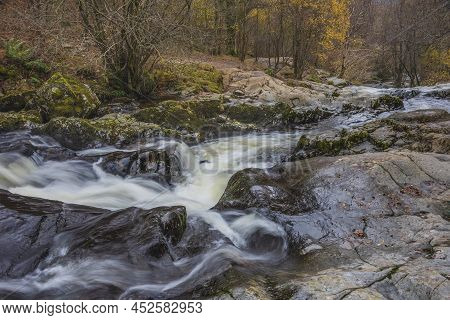 Epic Landscape Image Of Aira Force Upper Falls In Lake District During Colorful Autumn Showing