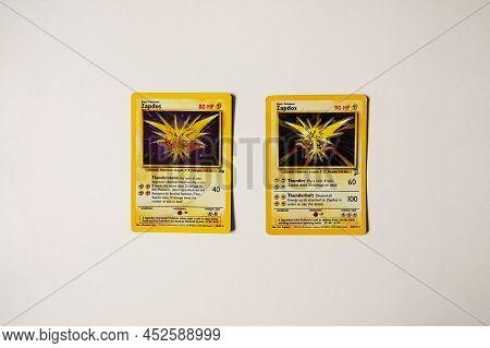 Prague, Czech Republic - April 3 2022: Two Versions Of Zapdos Card Front From First Editions. The Po