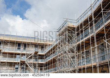 Construction Works In Progress At New Residential Multistorey Appartment Building Made Of Brick And 