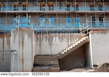 Retaining Wall And Pre-cast Stairs In Front Of The New Residential Multistorey Appartment Building M