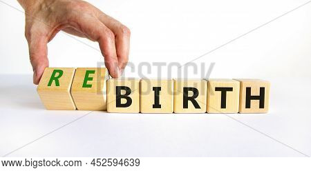 Birth Or Rebirth Symbol. Businessman Turns Wooden Cubes And Changes The Word Birth To Rebirth. Beaut