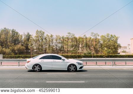 Dubai, Uae, United Arab Emirates - May 28, 2021: White Mercedes-benz Cls 400 Ii C218 Car Moving In C