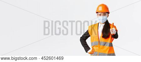 Covid-19 Safety Protocol At Enterpise, Construction And Preventing Virus Concept. Confident Asian Fe