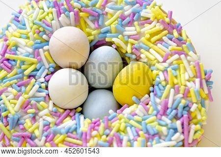 A Close Up Of A Easter Nest Dream Donut With Eggies