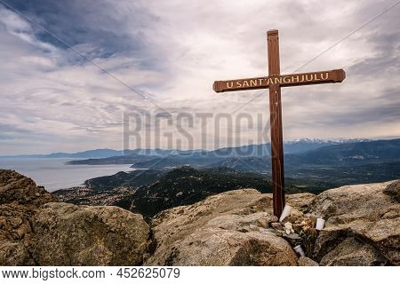 Cross At The Summit Of Cima Sant'anghjulu Near Corbara In The Balagne Region Of Corsica With The Coa