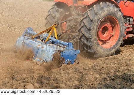 Field Preparation By Rotary Tiller Tractor In Farm