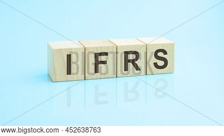 Ifrs - Word Written On Wooden Blocks. Text Is Written In Black Letters And Is Reflected In The Mirro