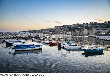Wiew Over Fish Boats Embarked In The Bay Of Napoli On A Gloomy Spring Evening. Napoli Waterfront Wit