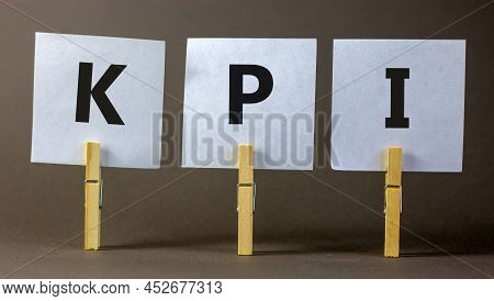 Kpi, Key Performance Indicator Symbol. Concept Word Kpi, Key Performance Indicator On White Papers O