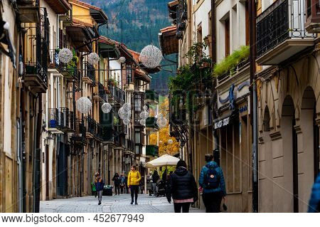 Onati, Spain-december 8, 2021 : People Walking On The Street Between Old Building In Spain. Travel I