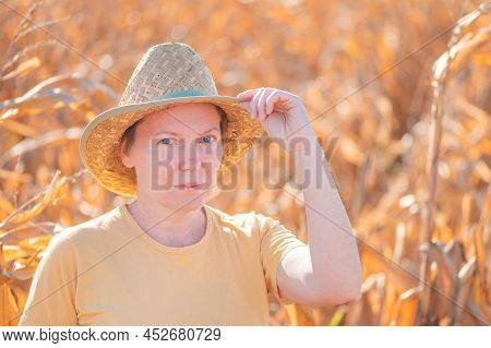 Female Agronomist And Farmer Standing In Ripe Harvest Ready Dent Corn Field And Looking Over Plantat