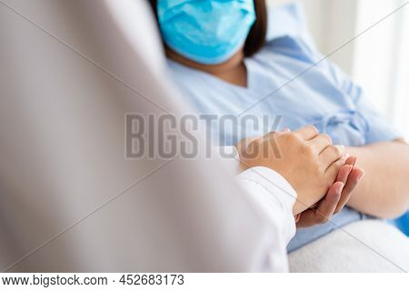 Women Asian Doctors Hold The Patient Hand And Encourage And Provide Medical Advice While Checking Th