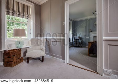 Fen Drayton, England - June 7 2018: Luxury Furnished Suite With Seating Area And Door Open To Bedroo