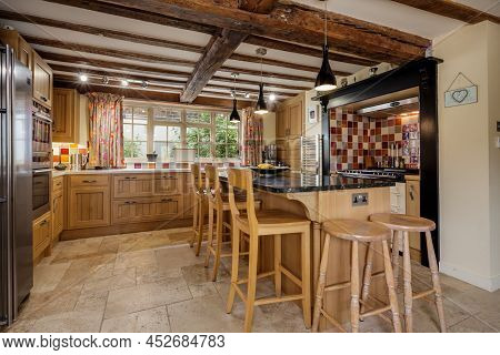 Fen Drayton, England - June 7 2018: Traditional Style Kitchen With Peninsular Breakfast Island And S
