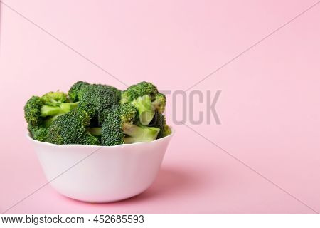 Broccoli Of Fresh Green Broccoli In Bowl Over Coloredbackground. , Close Up. Fresh Vegetable.