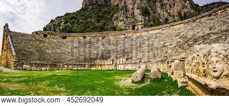 The Theatre Of Myra With The Rock-cut Tombs Of The Ancient Lycian Necropolis On The Cliff In The Bac