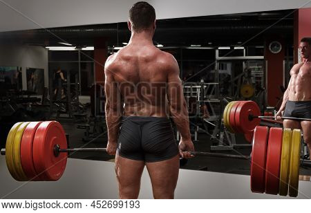 Strong Man Doing Deadlift Exercise In The Gym