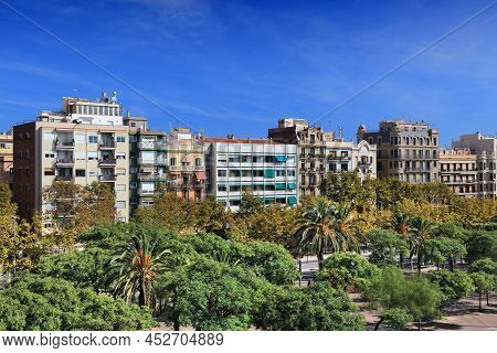 Cityscape Of Barceloneta District In Barcelona, Spain. In Foreground City Park Of Moll De La Barcelo