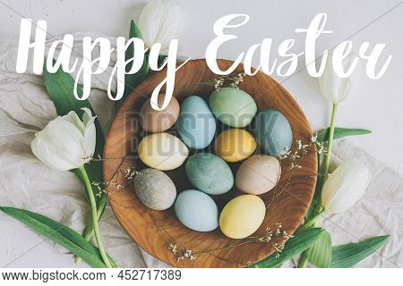 Happy Easter Greeting Card. Happy Easter Text And Stylish Easter Eggs In Wooden Plate, Tulips, Linen