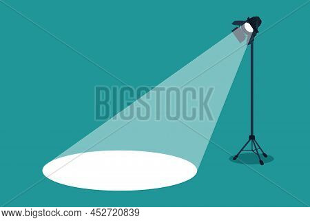 Silhouette Of Light Lamp Projector On Tripod With Scattered Rays. Projecting A Beam Of Spotlight Is 