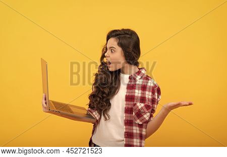 Angry Shocked Teen Girl Hold Laptop During School Online Lesson, Online School