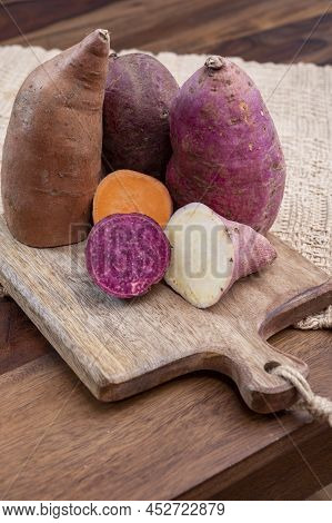 Colorful Root Vegetables Pink, Purple And Orange Organic Sweet Potatos