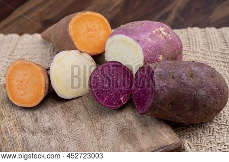 Colorful Root Vegetables Pink, Purple And Orange Organic Sweet Potatos