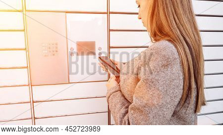 Post Locker. Delivery Automat Terminal And Hands With Parcel Courier Box. Parcel Delivery, Pickup Po