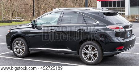 Monroeville, Pennsylvania, Usa April 10, 2022 A Used Lexus Suv For Sale At A Dealership On A Spring 