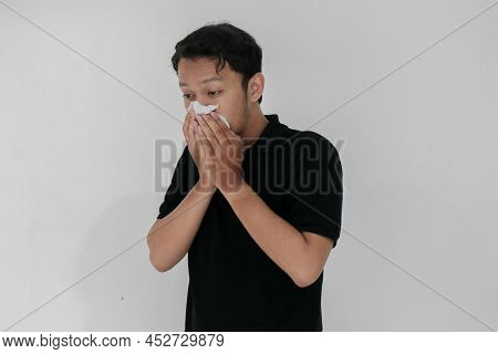 Sick Asian Man Flu And Cough Is Sitting With Using Tissue. Illness, Influenza, Pain Concept. Healthc