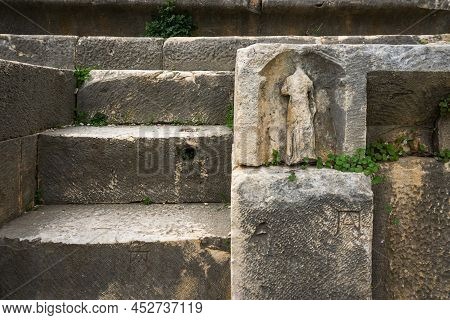 Myra Ancient City Theater Decoration. Relief Of A Woman In Clothes. Antalya, Turkey