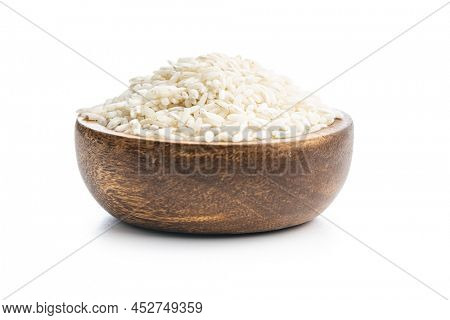 Uncooked Carnaroli risotto rice in bowl isolated on a white background.