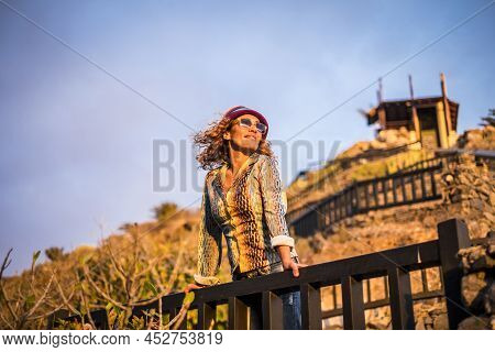 Beautiful Woman Standing And Ejoying The Sunset Sun Light On The Face - Portrait Of Young Pretty Fem