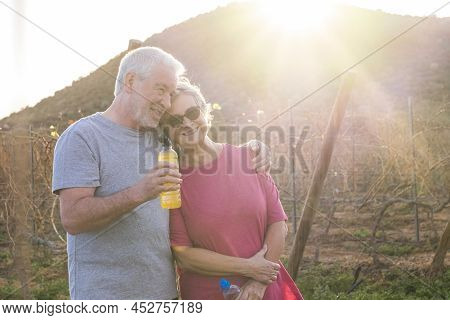 Happy Active Old People Couple Lifestyle Higging And Relaxing After Sport Running Session In The Mor