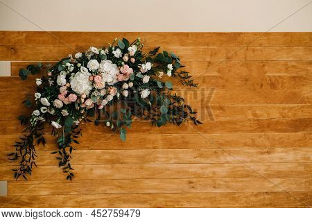 Wooden Wall Decorated Flowers. The Arch For The Ceremony Is Decorated With Flowers And Greens. Wood 