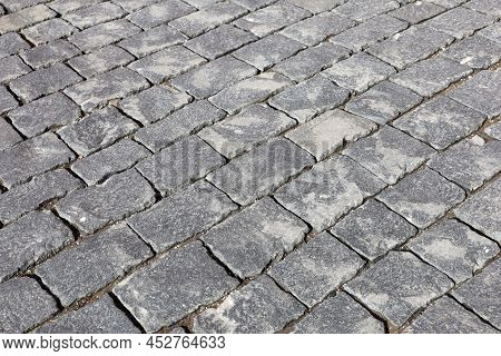 Gray Stone Pavement Texture, Cobbled Street. Old Paved Road With Tiles From Cobblestones
