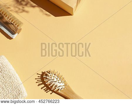 Bathroom Wellness Spa Accessories Concept Flat Lay On The Beige Background. Top View Frame With Hair