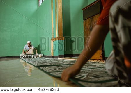 Muslim Young Male Cleaning The Mosque Before Praying