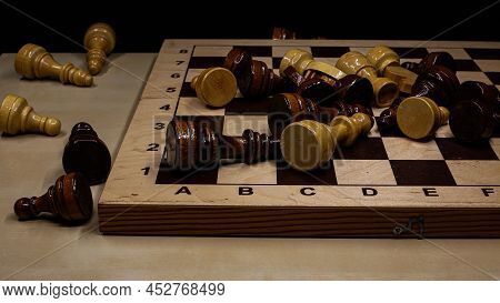 Shabby Folding Wooden Chessboard. Playing Chess With Wooden Lacquered Pieces. Black And White Square