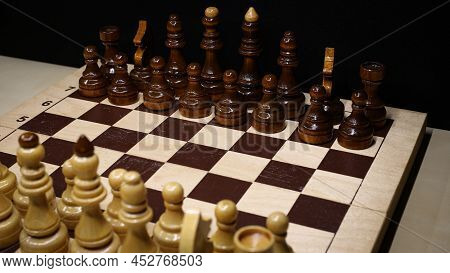 Shabby Folding Wooden Chessboard. Playing Chess With Wooden Lacquered Pieces. Black And White Square