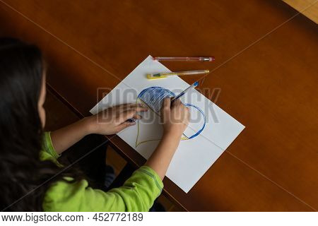 Childrens Hand With Pencil Draws The Heartl