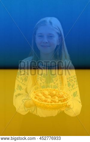 Defocus Ukrainian Smiling Girl In Vyshyvanka Holding Basket Of Colored Red Eggs On Black Background.