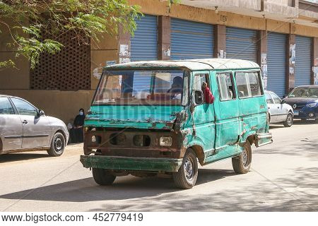Giza, Egypt - January 26, 2021: Crumpled Urban Minibus Eltramco Ramzes In A City Street.