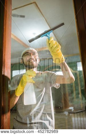 Muslim Young Male Cleaning The Mosque Before Praying
