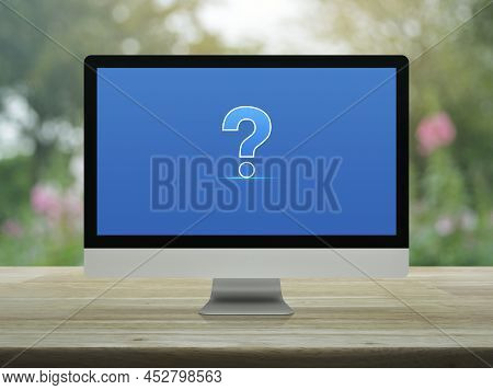Question Mark Sign Icon On Modern Laptop Computer Screen On Wooden Table Over Blur Pink Flower And T