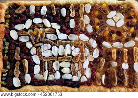 Easter Cake In Poland. Easter Pastry: Mazurek Cake Decorated With Almonds And Dried Fruit. Easter In