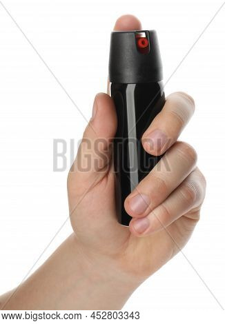 Man Holding Pepper Spray On White Background, Closeup