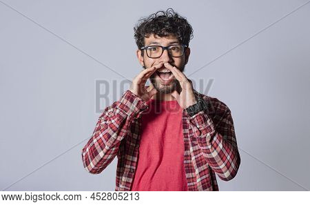 Attractive Man Announcing With Hands, Friendly Young Man Announcing From Front, Man Announcing And Y