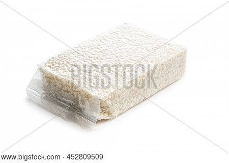 Packed Carnaroli risotto rice isolated on a white background.